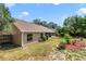 Mature landscaping surrounds this beautiful backyard with a screened-in lanai, offering a peaceful retreat at 2226 Lake Marion Dr, Apopka, FL 32712