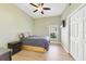 Cozy bedroom with a ceiling fan, closet, and a neutral color scheme creating a serene atmosphere at 2226 Lake Marion Dr, Apopka, FL 32712