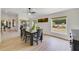 Dining area filled with sunlight, neutral walls, and backyard views at 2226 Lake Marion Dr, Apopka, FL 32712