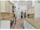 Kitchen featuring stainless steel appliances, granite countertops, and ample cabinet space at 2226 Lake Marion Dr, Apopka, FL 32712