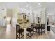 Open-concept kitchen with granite countertops and a breakfast bar with seating at 2226 Lake Marion Dr, Apopka, FL 32712