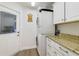 Convenient laundry area with modern washer, dryer, and counter space for added functionality at 2226 Lake Marion Dr, Apopka, FL 32712