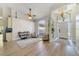 Bright living room boasting tall ceilings, hardwood floors, large windows, and an inviting entryway for a welcoming ambiance at 2226 Lake Marion Dr, Apopka, FL 32712