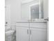 Bright bathroom features white cabinets, a new toilet and fixtures at 2956 Arranmore Dr, Ormond Beach, FL 32174
