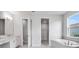 Bright bathroom featuring double vanity, soaking tub, and walk-in closet at 2956 Arranmore Dr, Ormond Beach, FL 32174