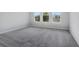 Bright bedroom features neutral walls and new carpet at 2956 Arranmore Dr, Ormond Beach, FL 32174