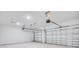 A spacious, two-car garage with ample lighting and white walls and doors at 2956 Arranmore Dr, Ormond Beach, FL 32174