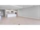 Open-concept kitchen and living area feature neutral walls and modern fixtures at 2956 Arranmore Dr, Ormond Beach, FL 32174