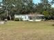 Charming home with a screened porch and a spacious yard at 31029 Nocatee Trl, Sorrento, FL 32776