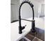 Close up of quartz countertop with a stainless steel sink and matte black faucet at 4655 Sw 139Th Ln, Ocala, FL 34473