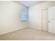 Bedroom featuring a window, neutral walls, neutral carpet and a closet at 12285 Joshua Tree Trl, Windermere, FL 34786