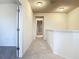 Upstairs hallway with neutral carpet and walls, multiple doors, and recessed lighting at 12285 Joshua Tree Trl, Windermere, FL 34786