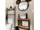 Stylish powder room with decorative Mickey Mouse mirror and fun decor at 2097 Celebration Blvd, Celebration, FL 34747