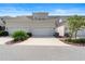 Condominium exterior featuring attached garages, well manicured landscaping, and a paved driveway at 2097 Celebration Blvd, Celebration, FL 34747