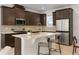 Gourmet kitchen with stainless steel appliances, stone countertops, and a breakfast bar at 2097 Celebration Blvd, Celebration, FL 34747