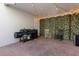 Cozy outdoor patio with brick pavers, string lights, and privacy greenery at 2097 Celebration Blvd, Celebration, FL 34747