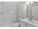 Modern bathroom with white marble tile shower and vanity at 2102 Kingswood Ave, Deltona, FL 32725
