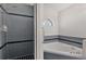 Bathroom with a shower and corner tub at 2102 Kingswood Ave, Deltona, FL 32725
