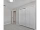 Bedroom with double doors leading to the bathroom at 2102 Kingswood Ave, Deltona, FL 32725