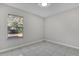 Spacious bedroom with a window overlooking the backyard at 2102 Kingswood Ave, Deltona, FL 32725