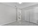 Bedroom with white closet doors and access to bathroom at 2102 Kingswood Ave, Deltona, FL 32725