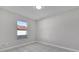 Bright bedroom with tile floors and a large window at 2102 Kingswood Ave, Deltona, FL 32725