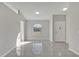 Open living area with tile floors and an arched window at 2102 Kingswood Ave, Deltona, FL 32725