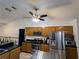 Kitchen with stainless steel appliances and wood cabinets at 3021 Norvell Ct, Deltona, FL 32738