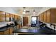 Eat-in kitchen with stainless steel appliances and wood cabinets at 3021 Norvell Ct, Deltona, FL 32738