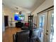 Spacious living room with large TV, piano, and comfy seating at 3021 Norvell Ct, Deltona, FL 32738