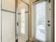 Bathroom featuring walk in shower and access to the outdoors at 5303 Wildwood Way, Davenport, FL 33837