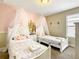 Charming bedroom with canopied twin beds at 5303 Wildwood Way, Davenport, FL 33837