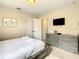 Bedroom featuring soft lighting and gray furniture at 5303 Wildwood Way, Davenport, FL 33837