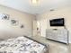 Bright bedroom features decor, dresser, and an open doorway at 5303 Wildwood Way, Davenport, FL 33837