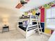 Whimsical bedroom featuring bunk beds and Disney-themed decor at 5303 Wildwood Way, Davenport, FL 33837