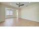 Spacious living room with tile flooring, ceiling fan, and open layout at 541 Cantabria Dr, Davenport, FL 33837