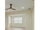 Bright living room with neutral tones and ceiling fan at 541 Cantabria Dr, Davenport, FL 33837
