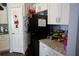 Kitchen with black appliances and white cabinets at 6640 S Goldenrod Rd # 118C, Orlando, FL 32822