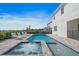 Backyard with a pool, integrated hot tub, lounge chairs, and view of adjacent homes at 159 Golden Noble St, Kissimmee, FL 34747