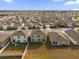 Community aerial view showcasing neighborhood homes with green spaces and well-maintained landscaping at 2665 Magnolia Ave, Davenport, FL 33837