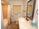 Bathroom featuring a tile-surround tub and shower, along with sleek fixtures at 306 Wild Olive Ln, Longwood, FL 32779