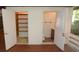 Convenient bathroom and closet with storage inside a home's screened-in lanai at 306 Wild Olive Ln, Longwood, FL 32779
