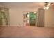 Spacious room with lanai doors and two large windows provides natural light at 306 Wild Olive Ln, Longwood, FL 32779