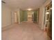 Primary bedroom with a large walk-in closet and a sliding glass door at 306 Wild Olive Ln, Longwood, FL 32779