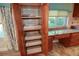 Pantry with pull-out shelves and granite countertops in the kitchen at 306 Wild Olive Ln, Longwood, FL 32779
