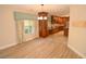 Kitchen with breakfast nook featuring hardwood cabinets and granite countertops at 306 Wild Olive Ln, Longwood, FL 32779
