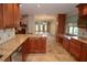 Gourmet kitchen showcases premium cabinets, granite countertops, and seamless flow to the living area at 306 Wild Olive Ln, Longwood, FL 32779