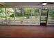 Screened lanai overlooks the lush backyard and features an entrance door at 306 Wild Olive Ln, Longwood, FL 32779