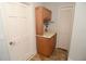 A functional laundry area with bright cabinets and a practical countertop at 306 Wild Olive Ln, Longwood, FL 32779