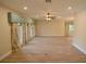 Spacious living room with tile floors, a ceiling fan, and large windows at 306 Wild Olive Ln, Longwood, FL 32779